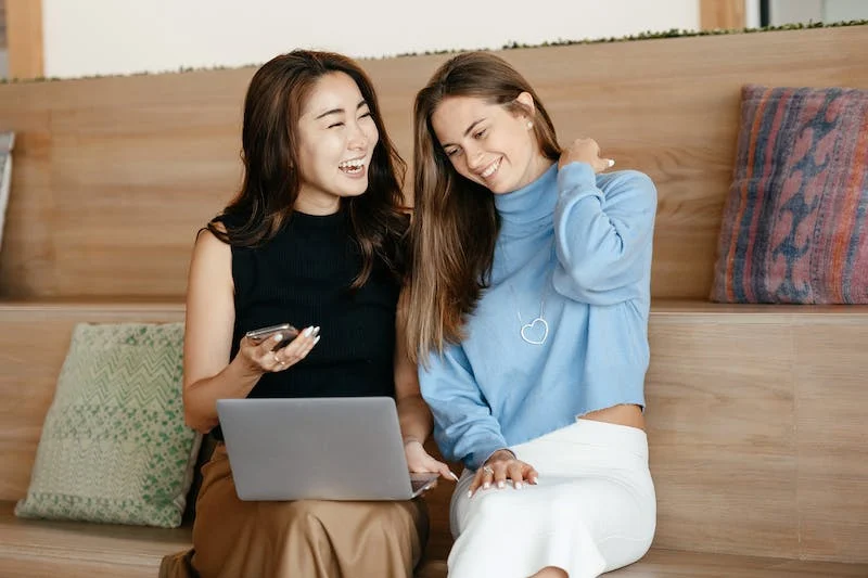 Two girls are discussing managing digital identification | Privy AU